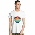 Man wearing a white t-shirt with a colourful palm tree design on a white background